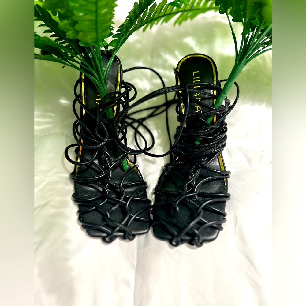 Wrap up the leg, caged design heels. Worn once.